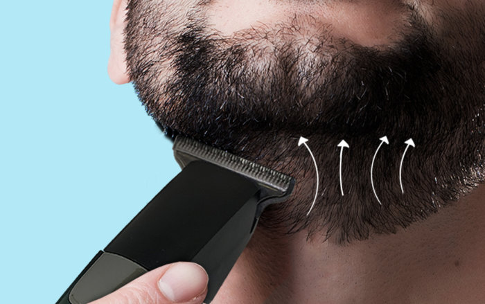 Turn the power button on and work the trimmer upward, against the direction of hair growth; removing excess bulk, going back over any parts, if required, using shorter trim settings until you are happy with the length.